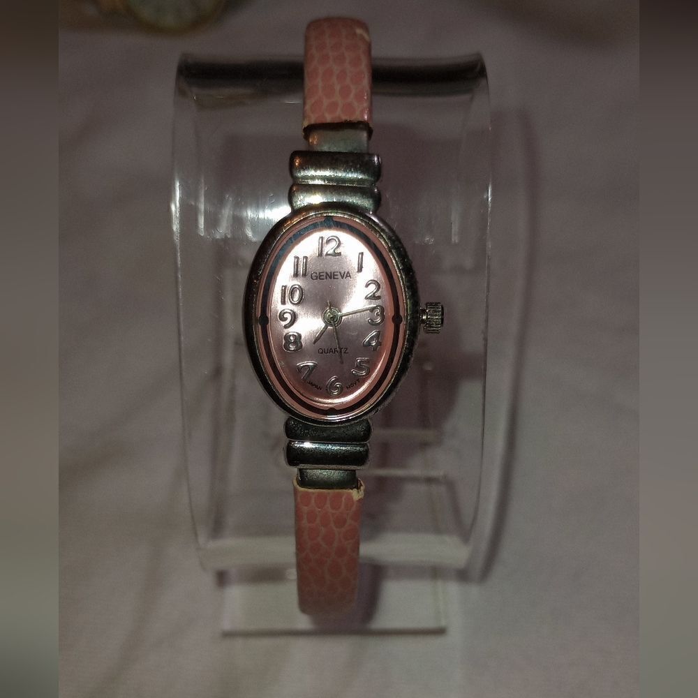 Geneva pink faced watch with a light pink leather band